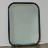 A Metal Framed Mirror with Brass Detailing