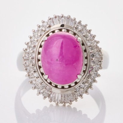 Platinum, 4.61ct Ruby Cabochon / 0.50ct Round / 0.19ct Baguette Diamond Cluster Ring