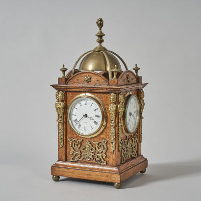 An Oak Four Dial Clock with Brass Filgree Details