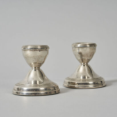 A Small Pair of Sterling Silver Candlesticks