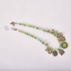 An Asian Aged Jade Bead and Silver Pendant Necklace