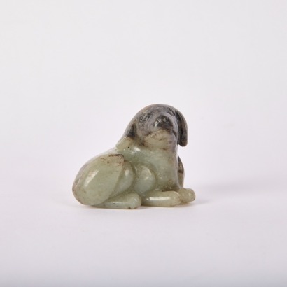 A Chinese Ming Dynasty Carved Hetian Jade Dog