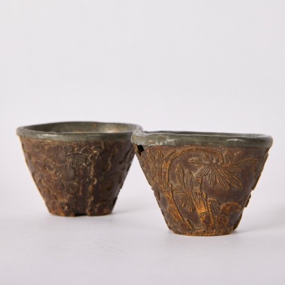 A Pair of Chinese Qing Dynasty Coconut Shell Carved Cups with Pewter Mounts