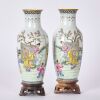 A Pair of Chinese Early 20th Century Republic Period Famille Rose &lsquo;Historical Figures&rsquo; Eggshell Porcelain Vases (Qianlong Year Marks) (With Original Wooden Stands)