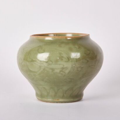 A Chinese Qing Dynasty Longquan Celadon Carved Jar
