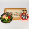 A European Framed Needlework Panel, A Chinese Black-Lacquer Floral-Decorated Panel AND A Mickey Mouse Clock