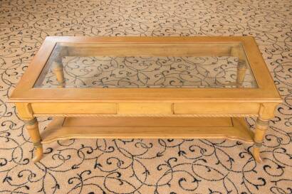 A Honey Coloured Glass Topped Coffee Table