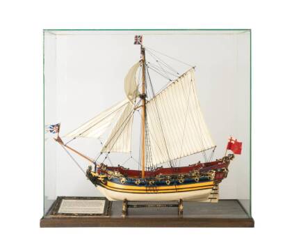 A Glass Cased Model of a Single Masted British Sailing Yatch HMY Katherine