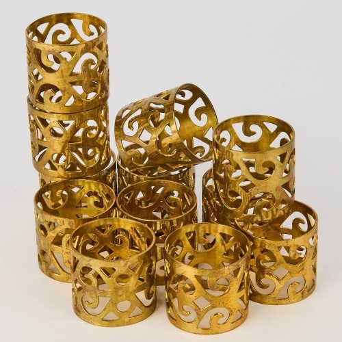 A Set of Twelve Brass Napkin Rings
