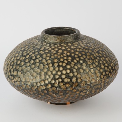 A Terracotta Pot with Dimples