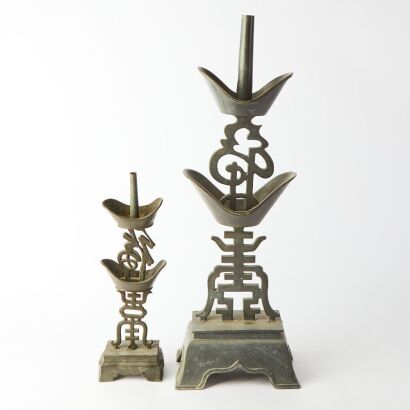 A Set of Two Late 19th Century Chinese Pewter Candlesticks with Fu and Shou motifs