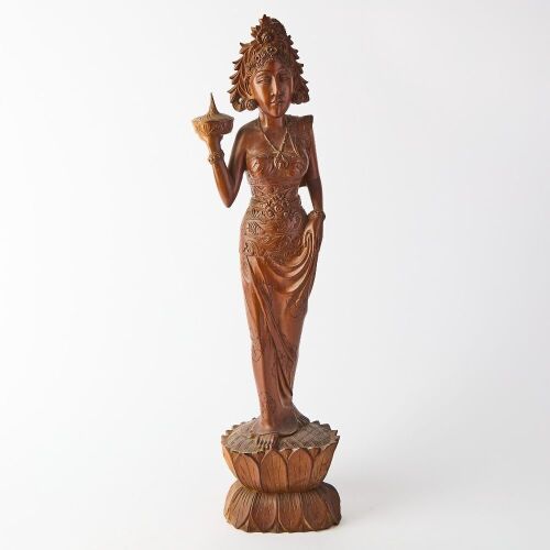 A Carved Wooden Figure of a Young Indonesian Girl