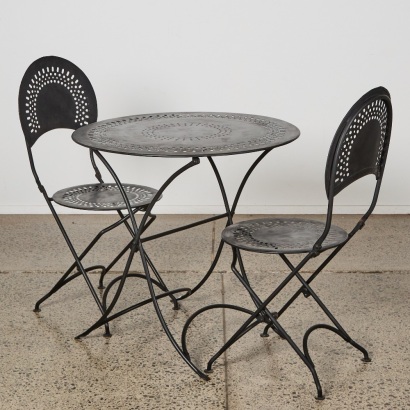 A Vintage Folding Wrought Iron French Bistro Setting