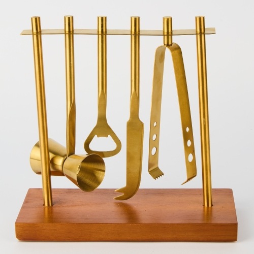 A Brass Bartender Cocktail Set on Wooden Stand