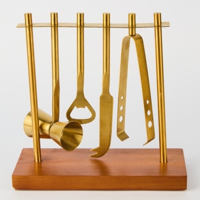 A Brass Bartender Cocktail Set on Wooden Stand