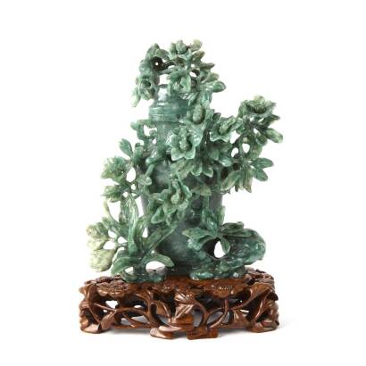 A Carved Chinese Bright Green Hardstone Urn Vase with Floral Arrangement