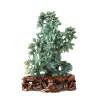 A Carved Chinese Bright Green Hardstone Urn Vase with Floral Arrangement