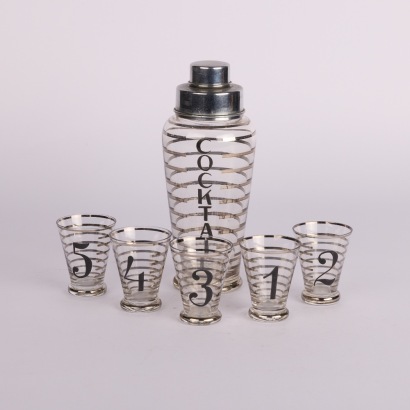 A Vintage Cocktail Shaker and Shot Glass Set