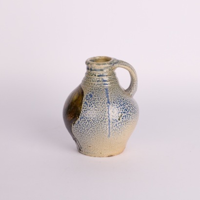 A Mark Goody Vase with a Handprints Wahine to Side