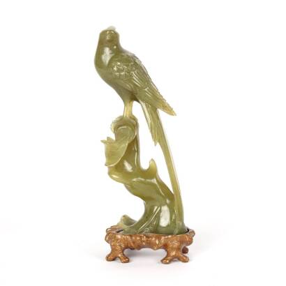 A Tall Chinese Carved Olive Green Hardstone Carving of a Mythical Bird on a Tree Stump Perch