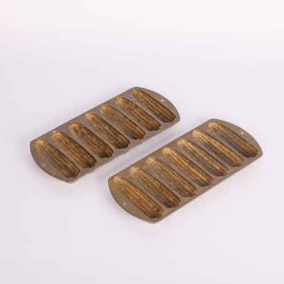 A Pair of Vintage Lodge USA Cast Iron Cornbread Gem Irons