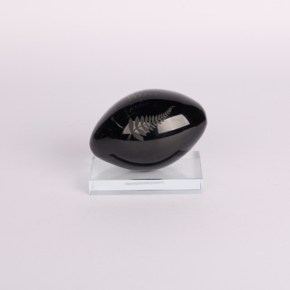 An Art Glass Rugby ball on Stand
