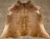 A Brown Cow Hide Rug