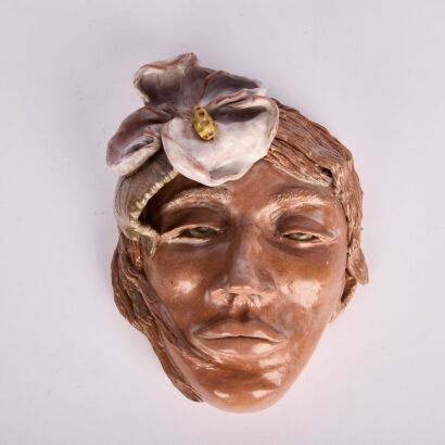 A Glazed Terracotta Face Sculpture