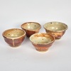 A collection of Four Pottery Bowls with Shino Speckled Glaze