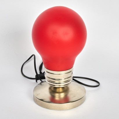 A Red Oversized Light Bulb Lamp