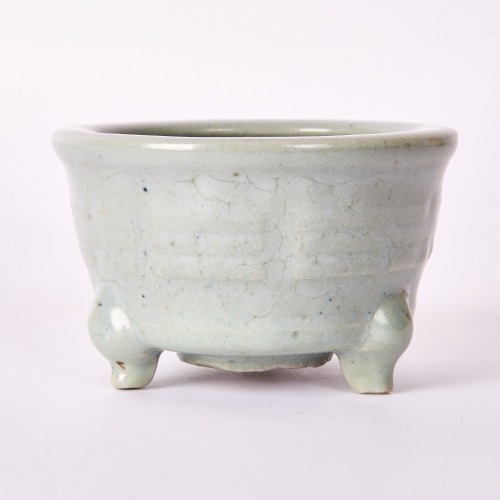A Chinese Song-Yuan Dynasty Longquan Celadon 'Eight Trigram' Tripod Censer