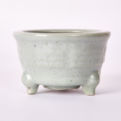 A Chinese Song-Yuan Dynasty Longquan Celadon 'Eight Trigram' Tripod Censer