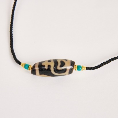 A Chinese Tibetan &lsquo;Treasure Vase&rsquo; Dzi Bead