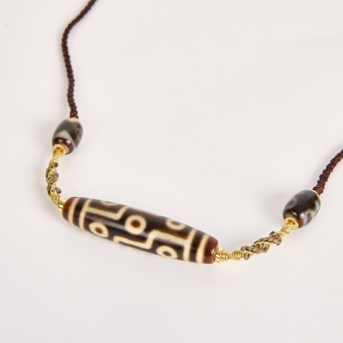 A Chinese Tibetan Nine-Eyed Dzi Bead