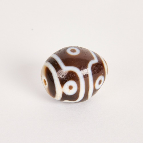 A Chinese Tibetan Six-Eyed Dalo Bead