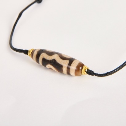 A Chinese Tibetan Three-Eyed Dzi Bead
