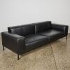 A Black Leather Couch and Ottoman - 2