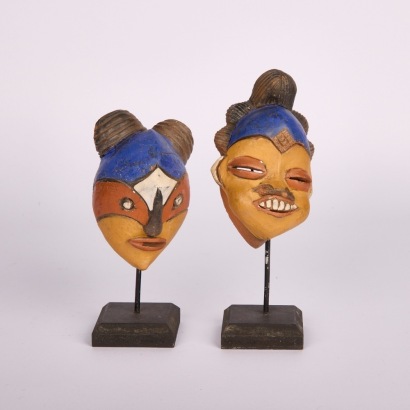 A Pair of Terracotta Clay Punu Head Masks from Gabon, with Stands