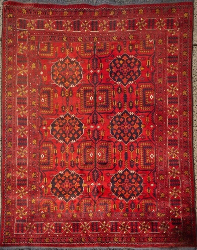 An Afghan Hand-Knotted Wool Carpet