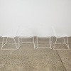 A Set of Four Wire Stackable Chairs - 2