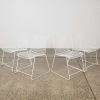 A Set of Four Wire Stackable Chairs