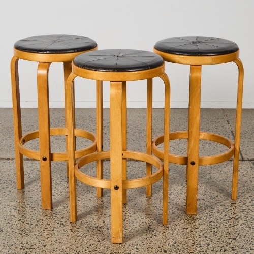 A Set of Three Bentwood and Leather Bar Stools, in the Manner of Alvar Aalto