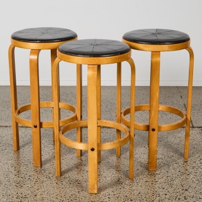 A Set of Three Bentwood and Leather Bar Stools, in the Manner of Alvar Aalto