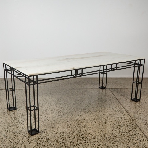 A Leccio Marble Dining Table Designed By Ceci Thompson for Crate and Barrel