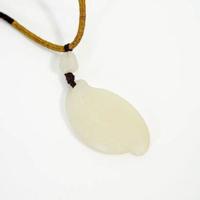 A Chinese 20th Century Carved Hetian White Jade Free-form Pendant