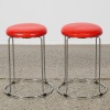 A Pair of Red Crocodile Embossed Stools