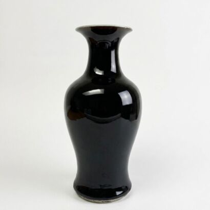 A Chinese 17th to 18th Century Kangxi Period Black-glazed Guanyin Vase
