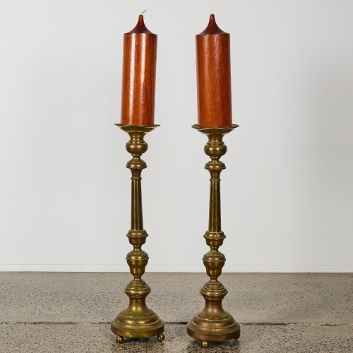 A Pair of Large Ornamental Candlesticks with Wooden Candles