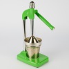 A Green Enamelled Lever Citrus Juicer Press