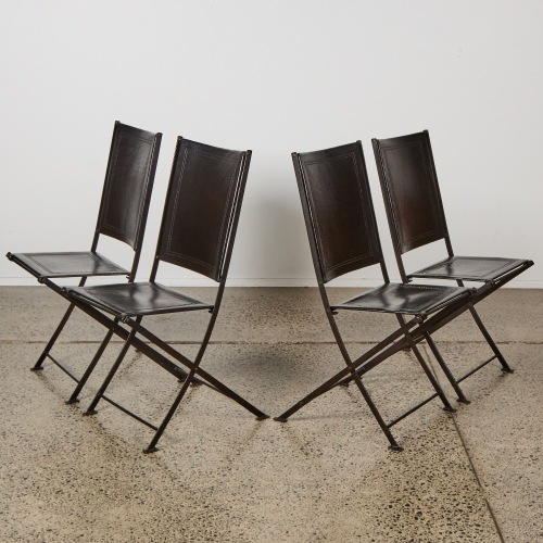 A Set of Four French Leather and Iron Folding Chairs